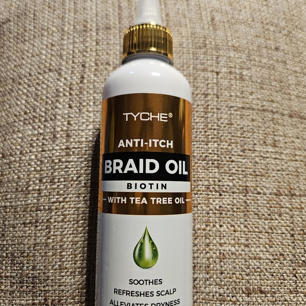 Tyche Braid Oil Bottle in White and Gold Packaging